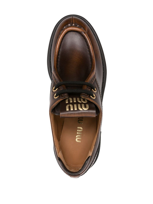 Logo-patch leather loafers 5E964D F 055 3KY8F0038 MIU MIU 