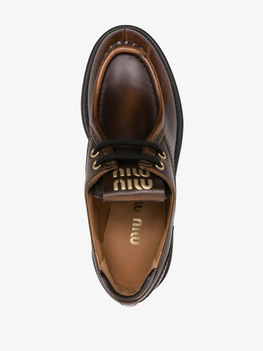 Logo-patch leather loafers 5E964D F 055 3KY8F0038 MIU MIU 
