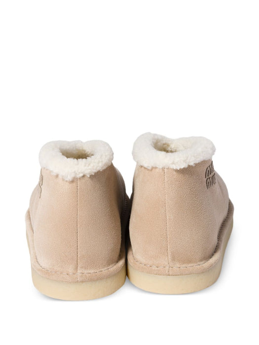 Embroidered-logo shearling boots 5T516E F ZF15 Z0GF0F24 MIU MIU 