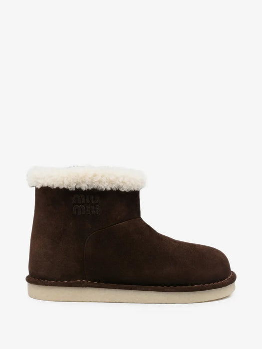 Shearling-trim logo-embossed boots 5T515E F ZF15 Z0GF0003 MIU MIU 