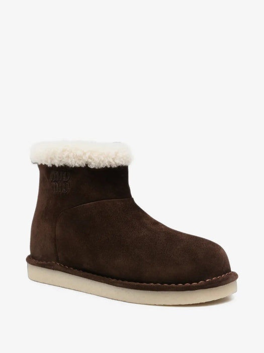 Shearling-trim logo-embossed boots 5T515E F ZF15 Z0GF0003 MIU MIU 