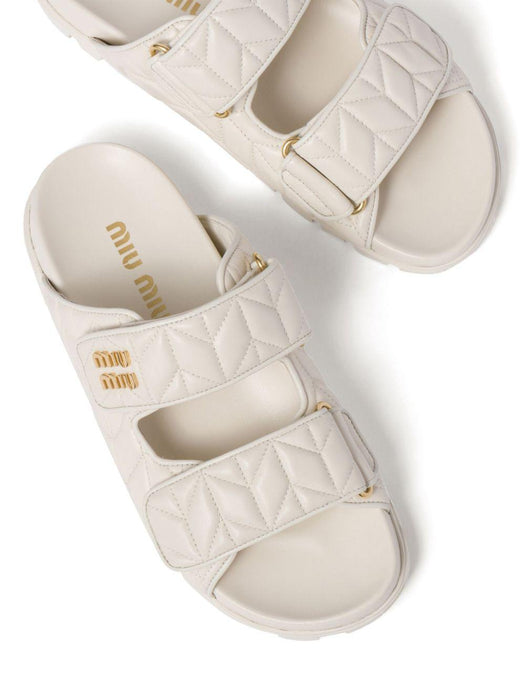 Matelassé nappa leather slides<BR/><BR/> 5XX640 F 010 88TF0009 MIU MIU 