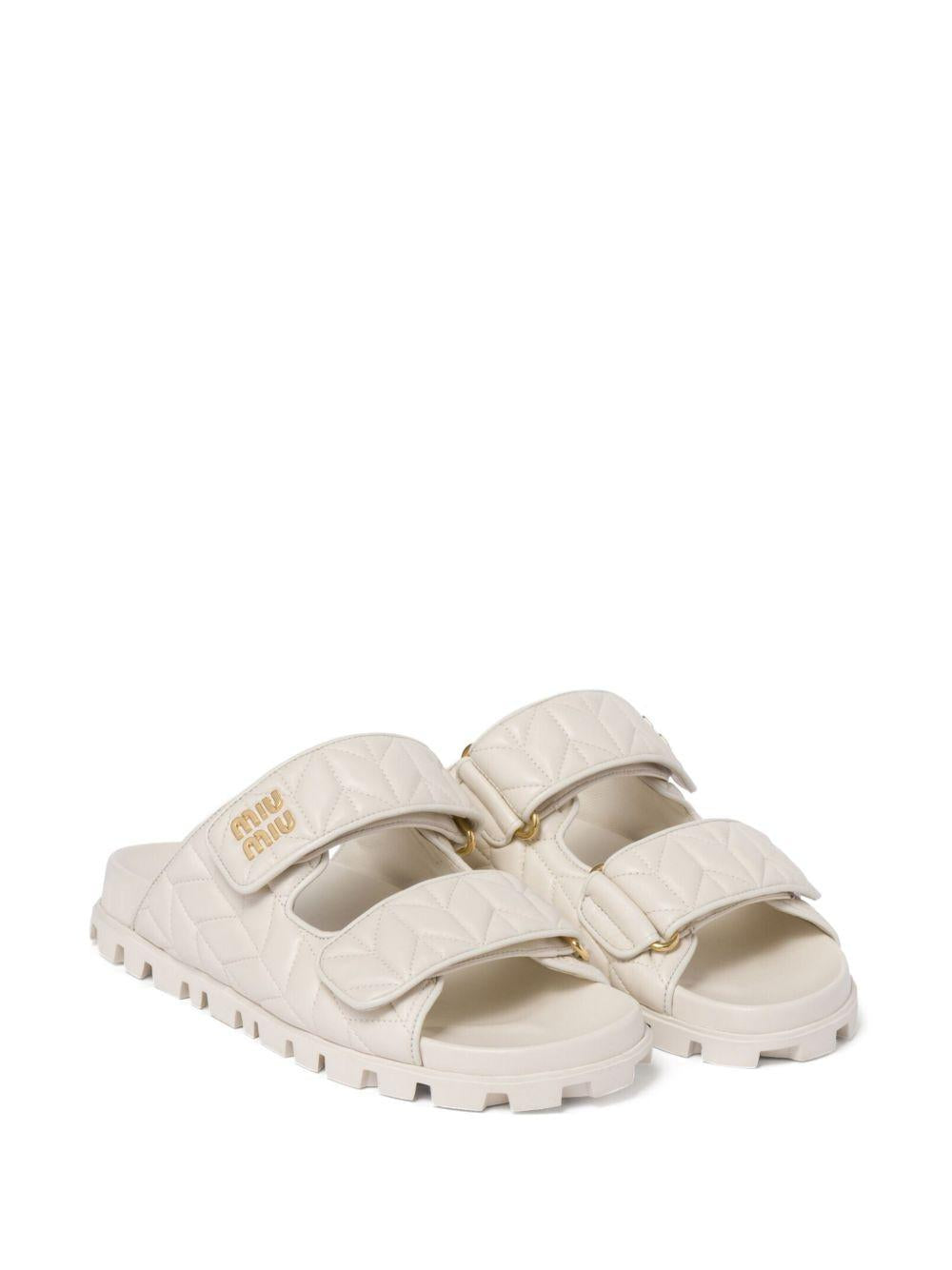 Matelassé nappa leather slides<BR/><BR/> 5XX640 F 010 88TF0009 MIU MIU 