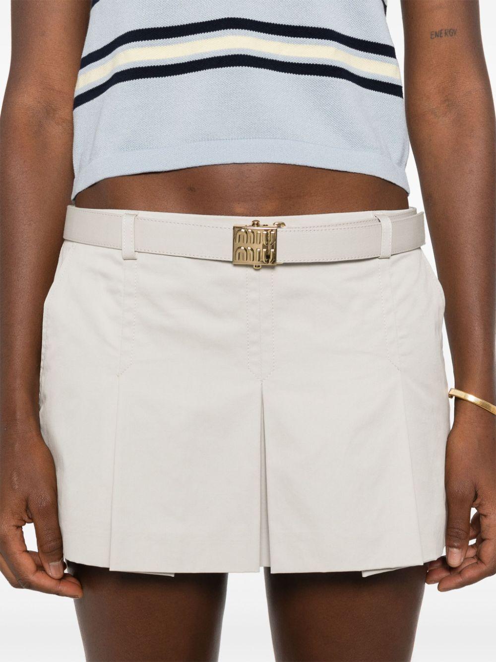 logo-buckle pleated miniskirt MG2258 S OOO 144DF0A08 MIU MIU 